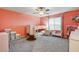 Charming bedroom featuring a playful design, ceiling fan, and plush carpeting at 7828 Stone Forest St, North Las Vegas, NV 89084