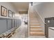 Charming entryway with staircase and tiled floors leading to the dining area at 7828 Stone Forest St, North Las Vegas, NV 89084