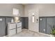 Welcoming entryway with tile flooring, two-tone wall, and storage furniture at 7828 Stone Forest St, North Las Vegas, NV 89084