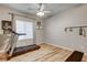 Home exercise room, offering wood floors, ceiling fan and workout equipment, providing convenience and motivation at 7828 Stone Forest St, North Las Vegas, NV 89084