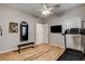 Well-equipped exercise room featuring laminate floors, ample lighting, and workout equipment, ready for fitness at 7828 Stone Forest St, North Las Vegas, NV 89084
