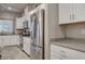 Modern kitchen boasts stainless steel appliances, granite countertops, and plentiful cabinet space for storage at 7828 Stone Forest St, North Las Vegas, NV 89084