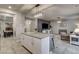 Open-concept kitchen with an island, seamlessly connecting to the dining and living areas for easy entertaining at 7828 Stone Forest St, North Las Vegas, NV 89084
