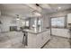 Open kitchen showcases the island, seamlessly connecting to the living area for a cohesive space at 7828 Stone Forest St, North Las Vegas, NV 89084