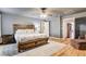 Cozy main bedroom with wooden floors, comfortable bed, and soft lighting at 7828 Stone Forest St, North Las Vegas, NV 89084
