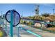 Community playground including handicap access, playground, and sitting area at 7828 Stone Forest St, North Las Vegas, NV 89084