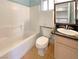 Clean bathroom featuring a vanity with dark countertops and a shower-tub combo at 8032 Astrology Ct # 201, Las Vegas, NV 89128