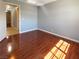 Light-filled bedroom featuring hardwood floors and neutral walls, ready for personalization at 8032 Astrology Ct # 201, Las Vegas, NV 89128