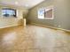 Bright bonus room featuring neutral paint, tile floors, and ample natural light at 8032 Astrology Ct # 201, Las Vegas, NV 89128
