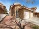 Charming home with a two-car garage, desert landscaping, and a tile roof at 8032 Astrology Ct # 201, Las Vegas, NV 89128