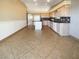 Open-concept kitchen featuring stainless steel appliances, ample counter space, and an island at 8032 Astrology Ct # 201, Las Vegas, NV 89128