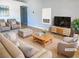 Bright living room showcasing neutral tones, modern decor, and an open floor plan, virtually staged at 8032 Astrology Ct # 201, Las Vegas, NV 89128