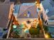 This aerial view shows the backyard with spa and lush landscaping at 8032 Marbella Cir, Las Vegas, NV 89128
