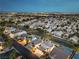Beautiful aerial community view featuring lush landscaping, with city views and easy access to nearby roads at 8032 Marbella Cir, Las Vegas, NV 89128