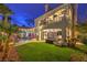 Expansive backyard featuring a pool, manicured lawn, patio, and balcony view at 8032 Marbella Cir, Las Vegas, NV 89128