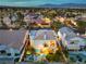 Entertainer's backyard with a covered patio, luxurious pool, spa, and lush landscaping at 8032 Marbella Cir, Las Vegas, NV 89128