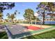 Outdoor community basketball court with lakeside views and seating area, ideal for residents to enjoy sports at 8032 Marbella Cir, Las Vegas, NV 89128