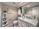 Bathroom vanity featuring a marble countertop, modern sink, and decorative elements at 8032 Marbella Cir, Las Vegas, NV 89128