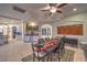 Elegant dining area with a unique marble fireplace, stylish decor and a convenient wet bar at 8032 Marbella Cir, Las Vegas, NV 89128