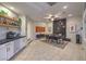 Modern dining area with marble fireplace, stylish decor, and convenient bar area at 8032 Marbella Cir, Las Vegas, NV 89128