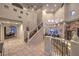 Spacious foyer with staircase leading to the second floor, and views to the kitchen and living room at 8032 Marbella Cir, Las Vegas, NV 89128