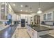 Elegant kitchen with stainless steel appliances, large island, and bright white cabinetry at 8032 Marbella Cir, Las Vegas, NV 89128