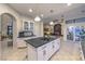 Open-concept kitchen with center island, granite countertops and an adjacent dining area at 8032 Marbella Cir, Las Vegas, NV 89128