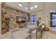 Spacious living room boasting high ceilings, unique wallpaper, and comfortable seating at 8032 Marbella Cir, Las Vegas, NV 89128