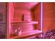Modern sauna featuring wooden benches and light-up panels to create a spa-like experience in the comfort of your own home at 8032 Marbella Cir, Las Vegas, NV 89128