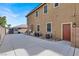 Home exterior view with shed, AC units and long concrete driveway and walkway at 8102 Villa De La Playa St, Las Vegas, NV 89131