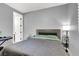 Bedroom featuring simple decor, neutral tones, and natural light from shuttered windows, along with a piano at 8102 Villa De La Playa St, Las Vegas, NV 89131