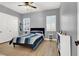 Bedroom featuring a ceiling fan, bright windows, and a neutral color palette at 8102 Villa De La Playa St, Las Vegas, NV 89131