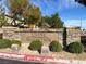 Stone Mountain community entrance sign with manicured landscaping in a well-maintained neighborhood at 8102 Villa De La Playa St, Las Vegas, NV 89131