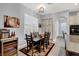 Charming dining area with seating for six, a wine refrigerator, and bright natural light at 8102 Villa De La Playa St, Las Vegas, NV 89131