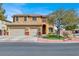 Charming two-story home featuring a well-manicured lawn, three-car garage and a classic color palette at 8102 Villa De La Playa St, Las Vegas, NV 89131
