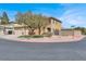 A two-story house on a corner lot featuring a well-maintained lawn and a three-car garage at 8102 Villa De La Playa St, Las Vegas, NV 89131