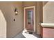 Inviting front door with decorative glass, stylish lighting, and a neutral color scheme at 8102 Villa De La Playa St, Las Vegas, NV 89131
