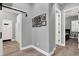 Hallway boasting wood floors, gray walls, stylish doors, and a decorative gallery at 8102 Villa De La Playa St, Las Vegas, NV 89131