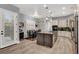 Well-equipped kitchen with a central island, modern appliances, and a cozy dining area at 8102 Villa De La Playa St, Las Vegas, NV 89131