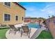 Beautiful pool area with rock waterfall and lounge chairs creating a luxurious backyard oasis for relaxation and recreation at 8102 Villa De La Playa St, Las Vegas, NV 89131