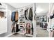 Walk-in closet with custom storage solutions, multiple shelves, and hanging space at 8102 Villa De La Playa St, Las Vegas, NV 89131