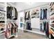 Customized walk-in closet with organized shelving, hanging racks, and ample storage at 8102 Villa De La Playa St, Las Vegas, NV 89131