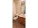 Bathroom featuring tile flooring, a wood vanity and a toilet at 8120 Finch Feather St, Las Vegas, NV 89143
