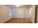 Spacious bedroom with natural light from the window and neutral carpeting, ready for personal touches at 8120 Finch Feather St, Las Vegas, NV 89143