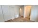 Bedroom with a closet, neutral carpet, and access to the bathroom at 8120 Finch Feather St, Las Vegas, NV 89143