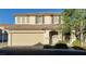 Two-story home featuring a two-car garage and well-maintained landscaping in a residential area at 8120 Finch Feather St, Las Vegas, NV 89143
