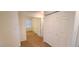 Hallway area with carpet and closet doors, leading to another room at 8120 Finch Feather St, Las Vegas, NV 89143