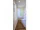 Staircase leading to the upper level, featuring neutral carpet, white walls and natural light at 8120 Finch Feather St, Las Vegas, NV 89143