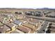 An aerial view of a neighborhood featuring single Gathering homes and apartments in a planned community at 827 Klamath Springs St, Henderson, NV 89011