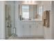 This bright bathroom offers double sinks and a glass enclosed shower at 827 Klamath Springs St, Henderson, NV 89011